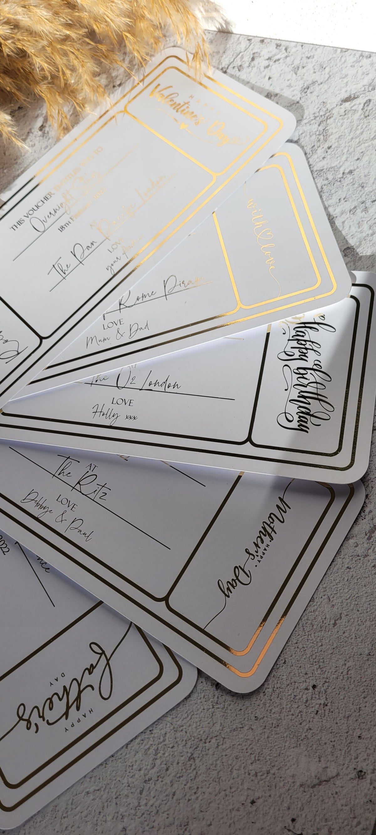 Gold foil golden ticket vouchers with occasion and heart designs