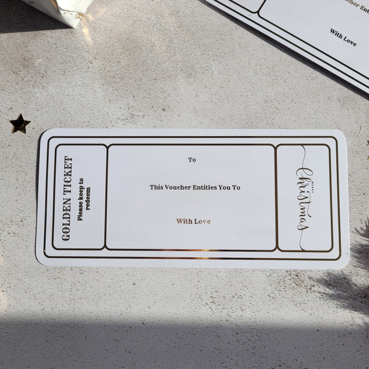 Blank Christmas golden ticket gift voucher in gold foil